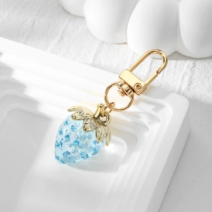 Blue strawberry keychain in transparent resin with gold metal leaves and lobster clasp