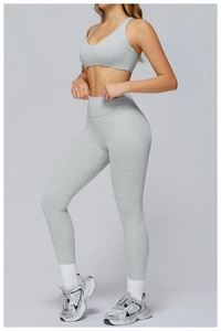 Detail of high-waist heather grey yoga set featuring compression leggings and V-neck tank