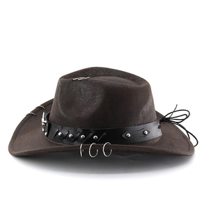 Close-up of brown cowboy hat with silver rivets and metal ring decorations on the brim