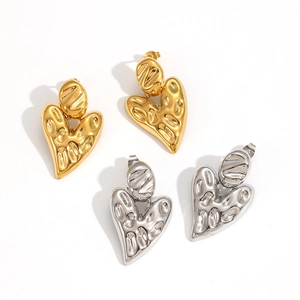 Minimalist lava-textured heart earrings in gold and silver finish with metallic shine