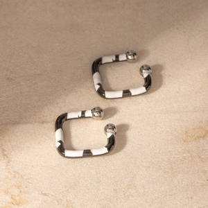 Modern square stainless steel ear cuffs with black and white zebra pattern enamel inlay