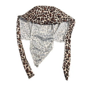 Detailed view of leopard print silk durag showing long tail ties and smooth satin texture