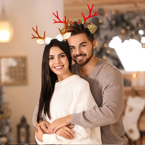 Detail of Christmas reindeer headbands with sequins, plush ears and festive decorations