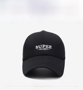 Close-up of white Super Degree embroidery on black twill cotton baseball cap