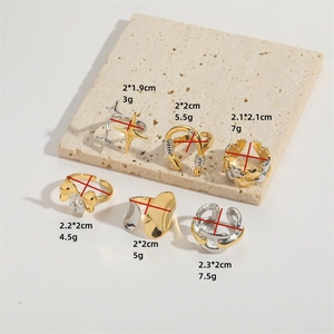 Set of two-tone gold and silver U-shaped star rings with size and weight specs