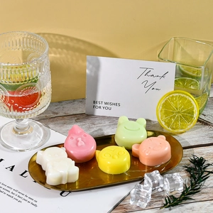 Detailed view of colorful animal-shaped soaps in a golden tray for gift-giving display
