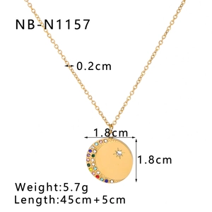 Macro view of 18k gold zodiac pendant necklace featuring cubic zirconia moon and star