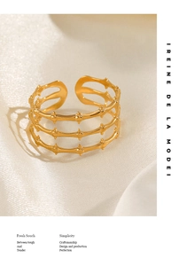 Detail of 18K gold plated stainless steel ring with a three-layer textured bamboo design
