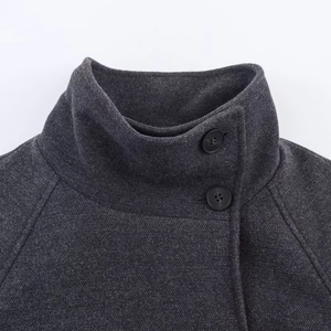 Dark grey wool coat with stand collar and two black buttons closeup detail view