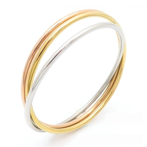 Polished three-tone interlocking titanium steel bangles in rose gold, gold and silver