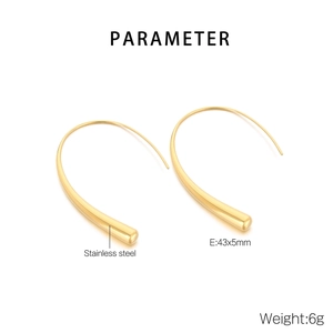 Detailed view of long curved titanium steel earrings in gold finish measuring 43x5mm