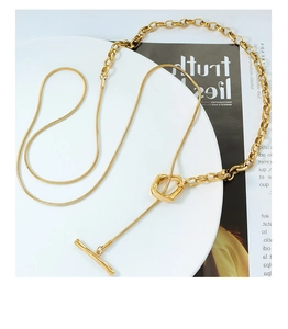 Detail of 18k gold plated titanium sweater necklace with OT toggle clasp and mixed chain links