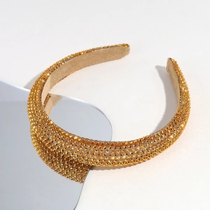Detailed view of luxury baroque headband with sparkling golden amber rhinestones
