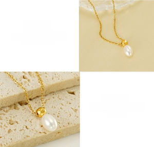Detail of titanium steel necklace with textured gold bead and oval pearl pendant