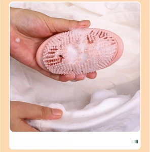 Pink silicone scrub brush detail showing dense bristles creating rich foam for laundry