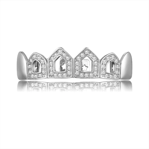 Macro detail of silver hip hop grillz with zircon inlay and star pattern engraving