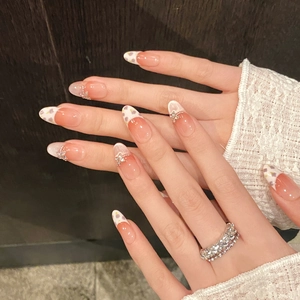 Floral almond press-on nails with 3D metal butterfly and sparkling rhinestones