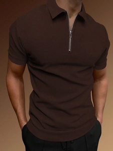 Close-up of brown knit polo shirt featuring a silver metal zipper and fine fabric texture