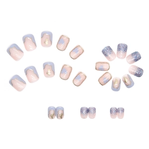 Short square press-on nails with cream blue marble pattern and glitter gradient design