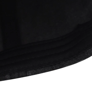 Macro view of triple-row stitching on black washed cotton baseball cap brim detail