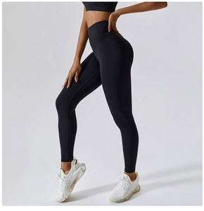 Side view of black high-waisted yoga leggings showing elastic fit and seamless design