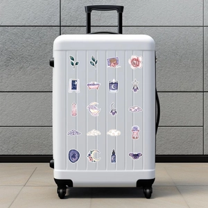 Holographic magic graffiti stickers set on white suitcase with dreamy purple plant patterns