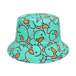 Detailed view of mint green bucket hat with cartoon duck pattern and quality canvas stitching