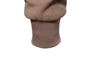 Detail of coffee brown waffle knit fabric and elastic ribbed cuff on the jacket sleeve