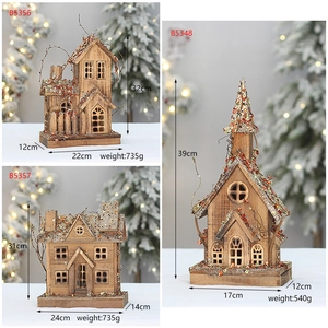Detailed comparison of three light-up wooden Christmas cabins with dimension markings