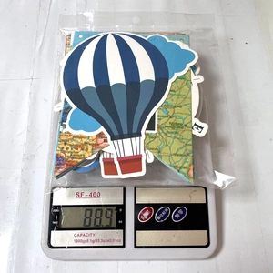 Detailed view of world map party banners and hot air balloon decorations in packaging