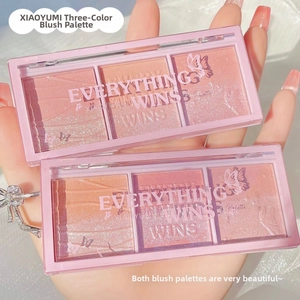 Close-up of three-color blush palette with matte and shimmer textures in peach and pink