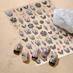 Macro detail of aurora laser butterfly nail stickers with 3D embossed texture and crystals