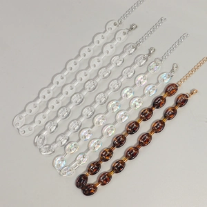 Three acrylic tortoise shell and iridescent chunky link necklaces with metal clasps