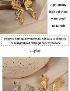 Detail of PVD gold plated butterfly earrings showing waterproof polished metal texture