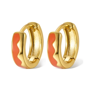Detailed macro shot of 925 sterling silver hoop earrings with orange enamel wave pattern