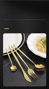 Macro view of gold stainless steel cutlery set showing corrosion resistant texture