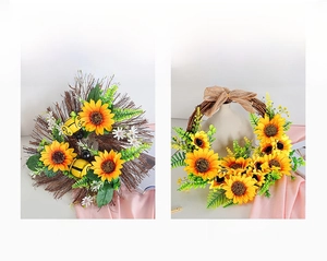 Detailed view of artificial sunflower wreaths with metal bees and burlap bow accents