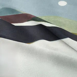 Close-up of bohemian mountain print tapestry showing soft fabric texture and sun design
