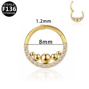 Close-up of gold F136 titanium segment ring with 5 beads and clear crystals, 1.2x8mm size