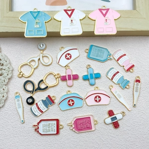 Detail of medical charms featuring nurse hats, stethoscopes, and thermometers in enamel