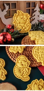 Macro view of cartoon cat-shaped cookies with embossed details for Christmas baking