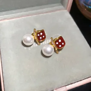Elegant 18K gold-plated pearl drop earrings with red dice charms and zircon accents