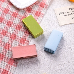 Macro view of colorful rectangular resin dessert charms in green pink and light blue