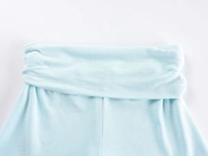 Detail of light blue knitted fabric waistband with delicate lace and elastic texture
