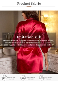 Macro shot of dark red satin robe fabric showing glossy texture and elegant drape