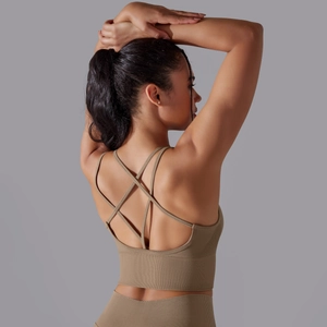 Detail of cross-back straps and ribbed texture on seamless yoga sports bra