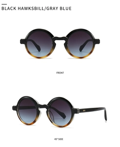 Close-up of retro round black tortoiseshell sunglasses with gray blue gradient lenses