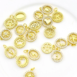 Gold zircon round pendant set featuring celestial heart and moon charm designs