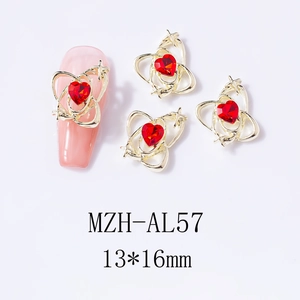 Detail of 13x16mm gold alloy hollow heart nail charm with red gemstone inlay