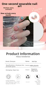 Detail view of 24pcs pink press-on nails with heart gems and rhinestones decorations